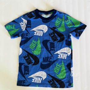The Nike Tee multi colored signature and logo shirt. Sz M